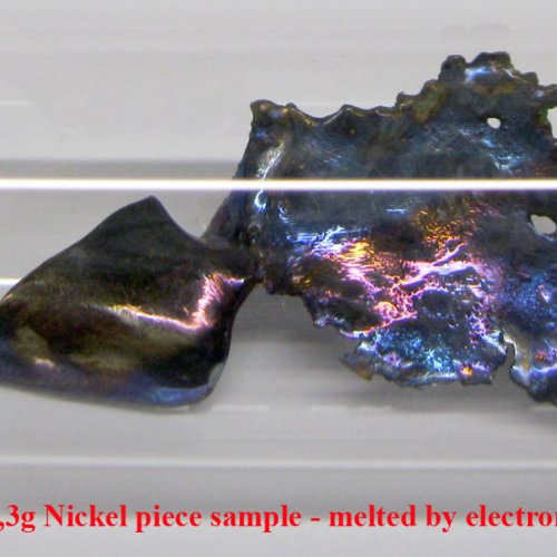 Nikl - Ni - Niccolum 3N5 2,3g Nickel piece sample-melted by electromagnetic induction-colored.jpg