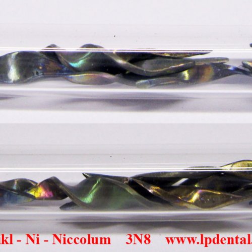 Nikl - Ni - Niccolum    Nickel machined piece-colored sufrace.